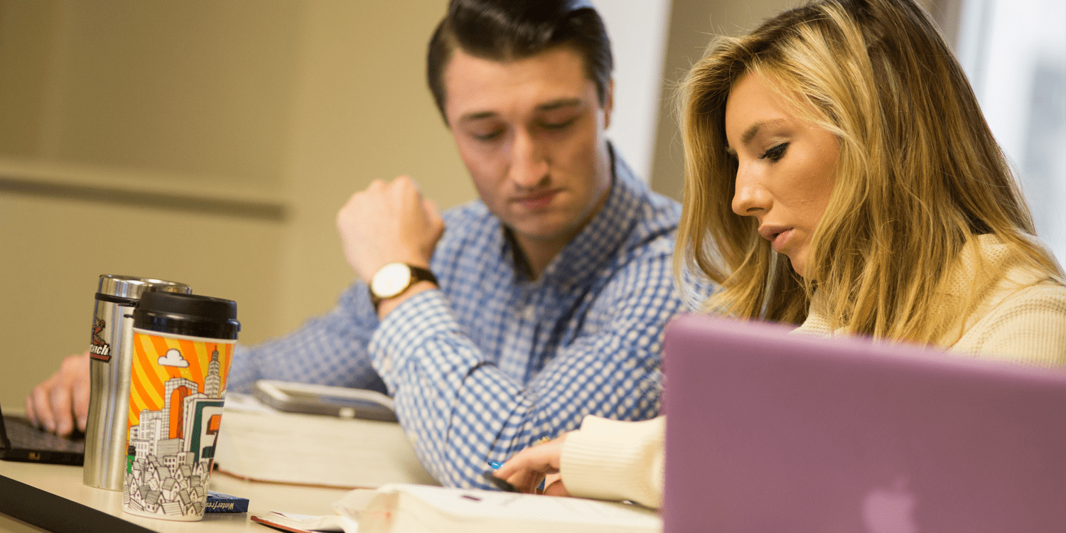 Woman And Man Looking At Book Together 1500X750